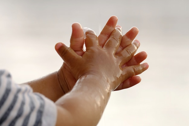 Photo raining into children's hands.