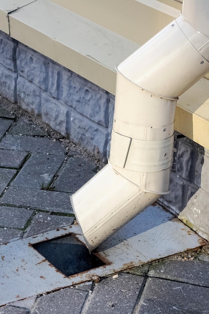 Rainwater drainage system on the sidewalk closeup