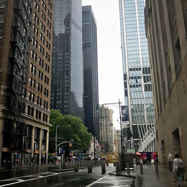 A rainy day in new york city with a buildings street