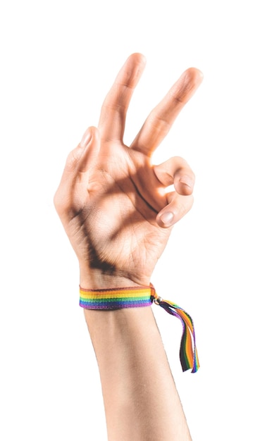 Raised arm wearing a bracelet with the colors of the LGBT flag