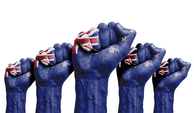 A raised fist of a protesters painted with the New Zealand flag