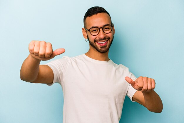 Raising both thumbs up smiling and confident