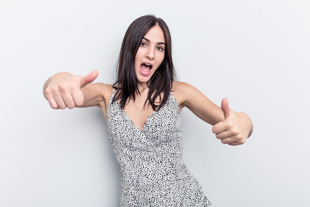 Foto alzando entrambi i pollici in su sorridente e fiducioso