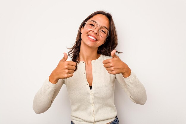 Raising both thumbs up smiling and confident