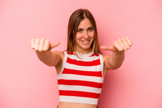 Raising both thumbs up smiling and confident