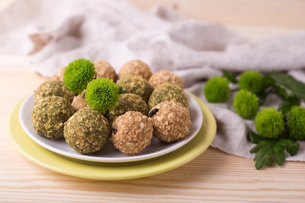 Raisins almond honey bliss balls. Matcha green tea date granola fruits energy balls.