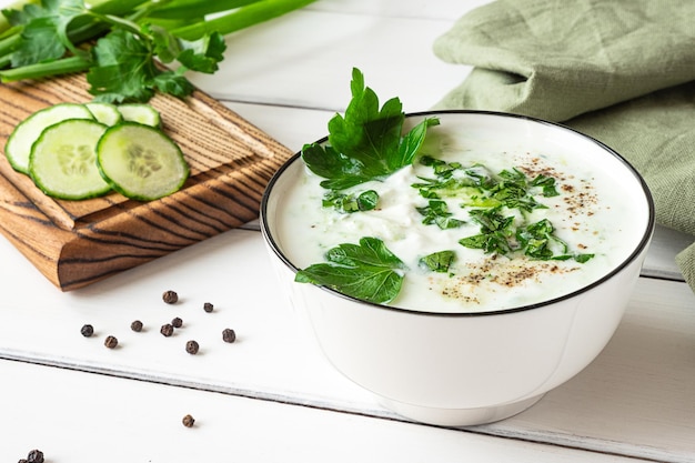 Raita indian cold side dish made with yoghurt and herbs