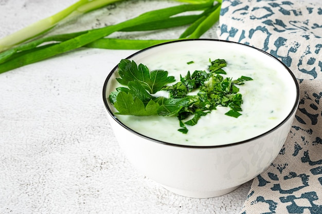 Raita indian cold side dish made with yoghurt and herbs