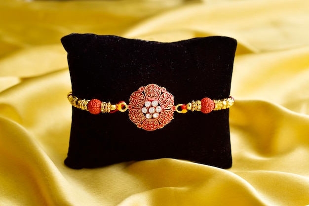 Raksha bandhan concept beautiful rakhi on cushion