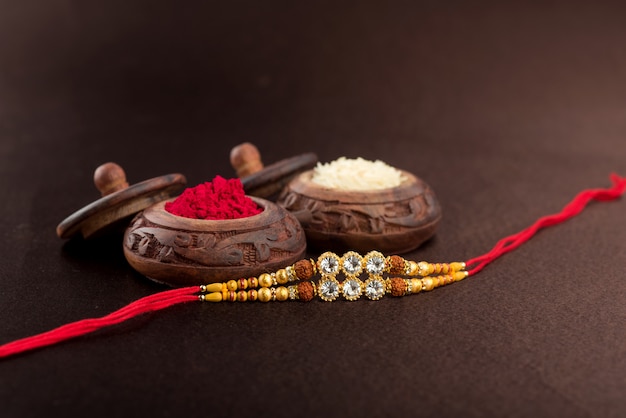 Raksha Bandhan near rice grains