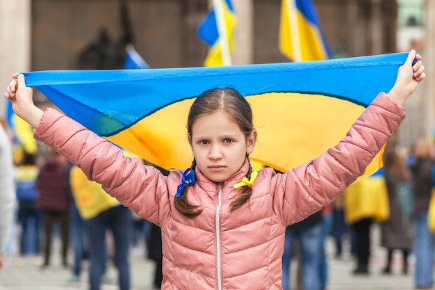 Rally Support Ukraine Ukrainian Flag in Girls hand Support Ukrainian Children Stand with Ukraine