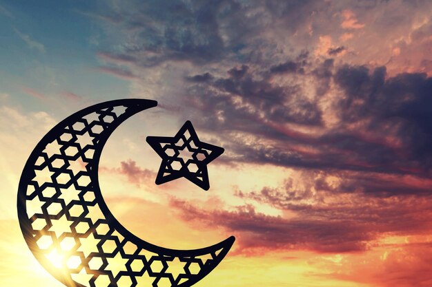 Foto ramadam kareem luna e stella sullo sfondo dell'alba e del tramonto rendering 3d