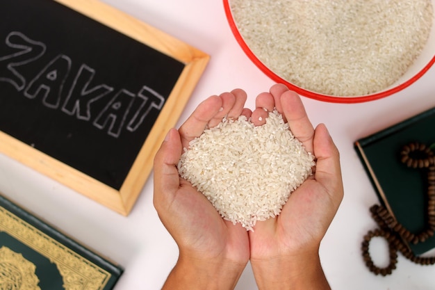 ramadan blessings hand with zakat rice quran prayer beads