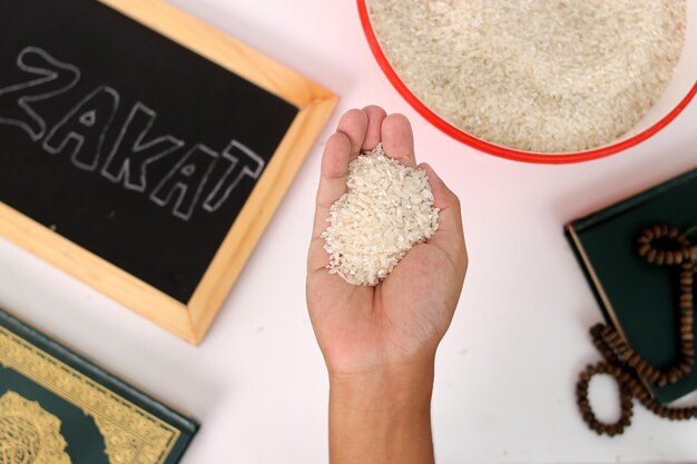 ramadan blessings hand with zakat rice quran prayer beads