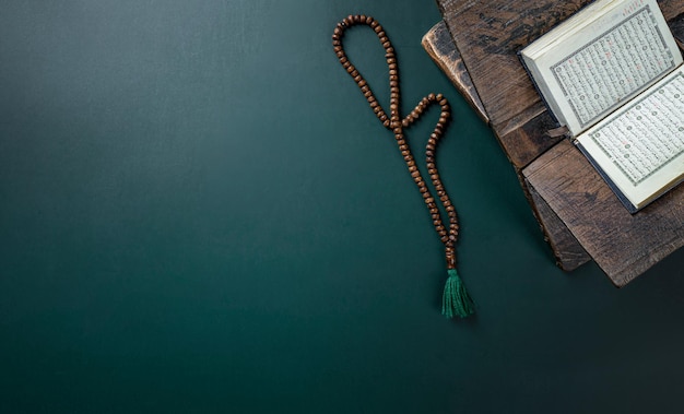 Ramadan concept with Quran prayer beads dates 