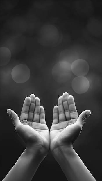 Photo ramadan kareem concept black and white prayer hands open two empty hands with palms up to pray god