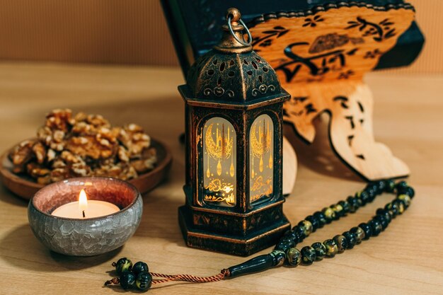 Ramadan Kareem and iftar muslim food holiday concept Trays with nuts and lanterns with candles Celebration idea