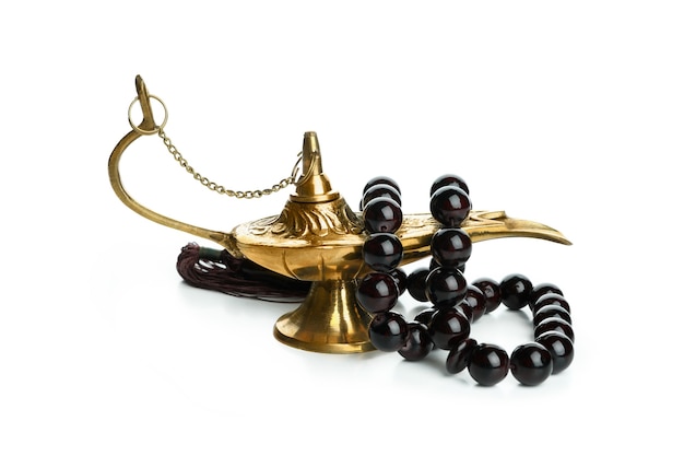 Ramadan lamp with prayer beads isolated on white surface