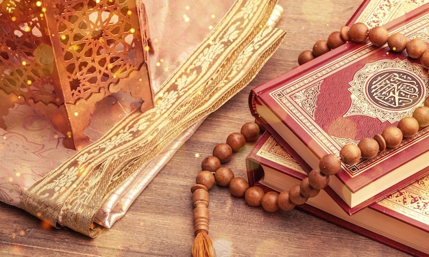 Ramadhan objects. Holy Quran and wooden cheekbones