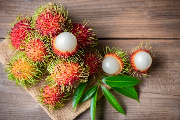 Rambutan fruit on wooden background harvest from the garden