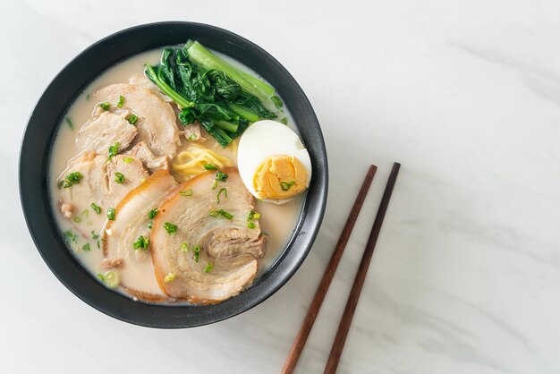 Ramen noodles in pork bone soup with roast pork and egg or Tonkotsu ramen noodles - Japanese food style