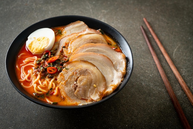 Ramen Noodles Spicy Tomyum Soup with Roast Pork