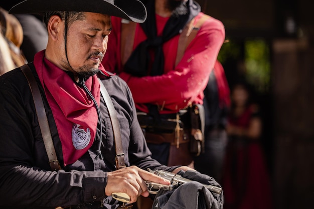 On the ranch a cowboy prepares for a gunfight