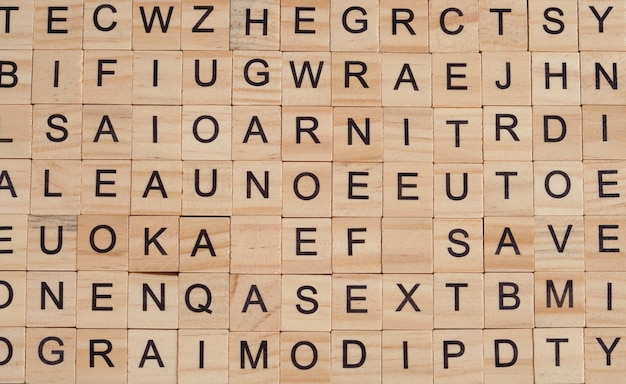 Photo random alphabet letter on wood block ,text background.