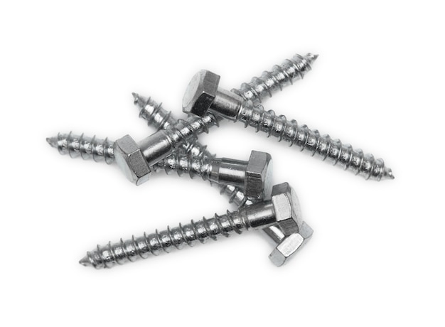 Random pile of hexagonal threaded steel bolts or screws  isolated