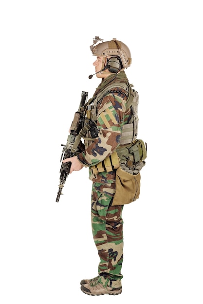 Ranger standing in woodland camouflage and modern machine gun Isolated on white background