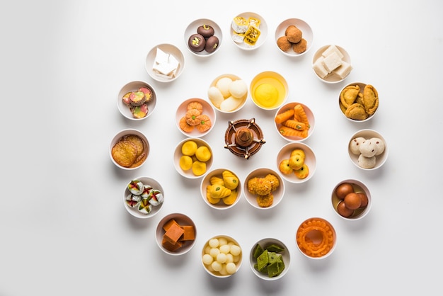 Rangoli of Assorted Indian sweets or mithai in bowl for Diwali or any other festivals, selective focus