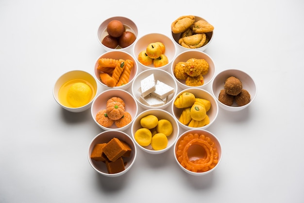 Rangoli of Assorted Indian sweets or mithai in bowl for Diwali or any other festivals, selective focus