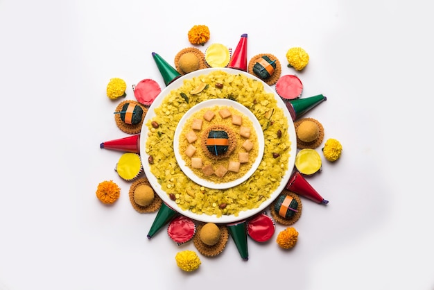 Rangoli or design made using Indian snacks or sweet and firecrackers or patakhe for Diwali festival