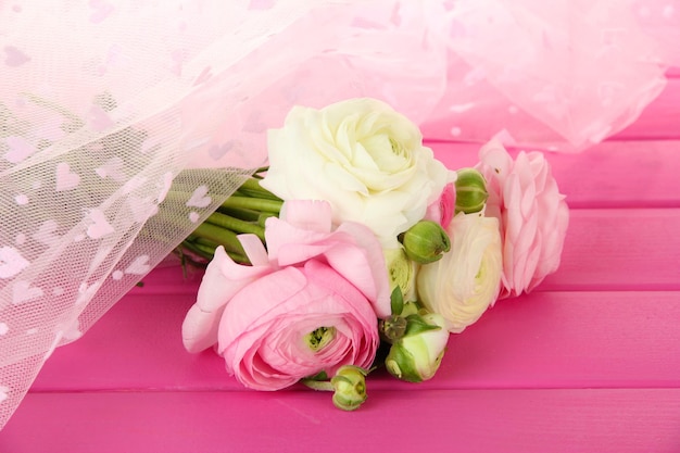 Photo ranunculus (persian buttercups), on pink background