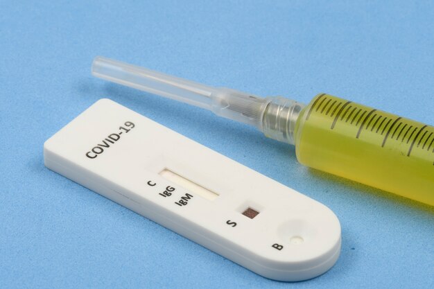 Rapid coronavirus test with syringe yellow liquid