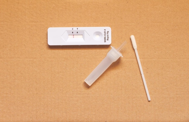 Rapid Covid19 coronavirus strip test cassette for antibody disease epidemic on brownpaper background