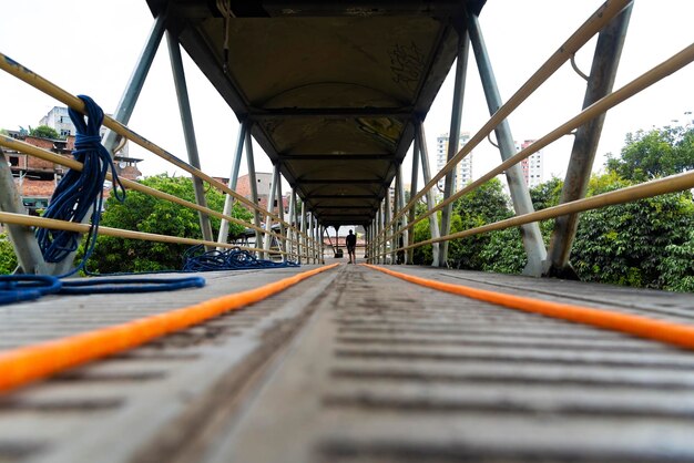 Rappelist organizing abseiling safety material on walkway