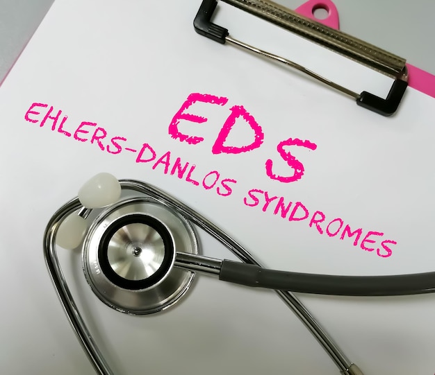 Rare disease Ehlers Danlos syndrome term on white background with stethoscope