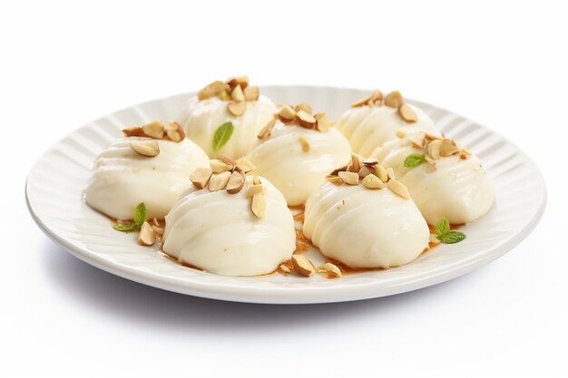 Photo ras malai with beeds on plate on white background