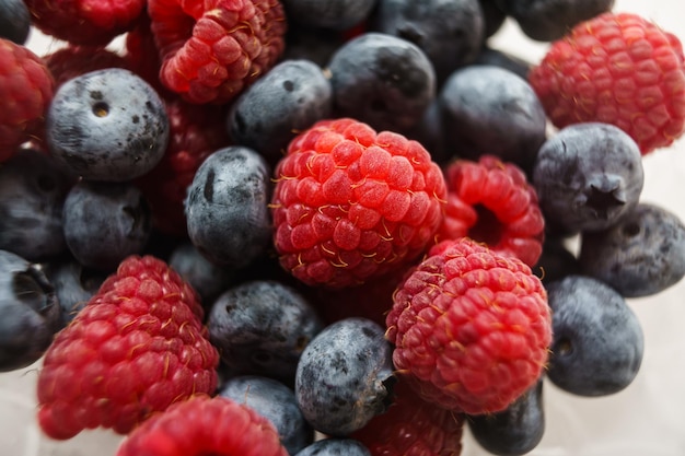 raspberries and blueberries on a plate