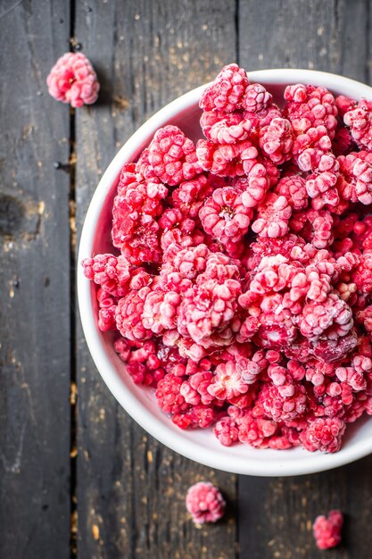 Raspberries frozen berry longterm storage preparation for the winter on the table healthy food