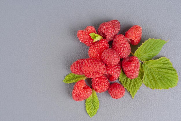 raspberries on a gray background empty space