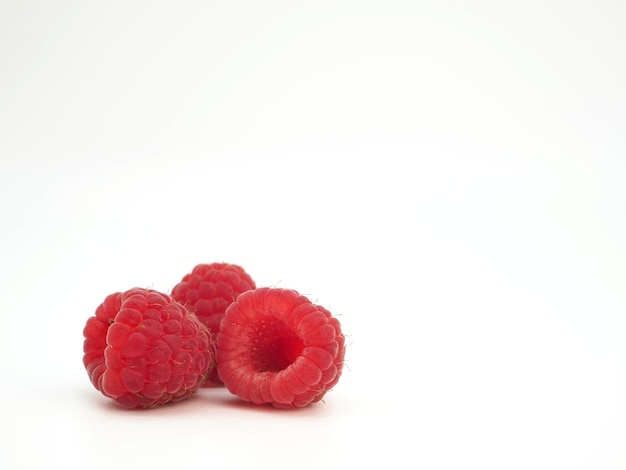 Raspberry berries isolated on white background Closeup