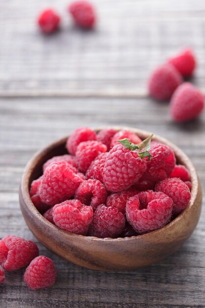 Raspberry berries in a wooden bowl