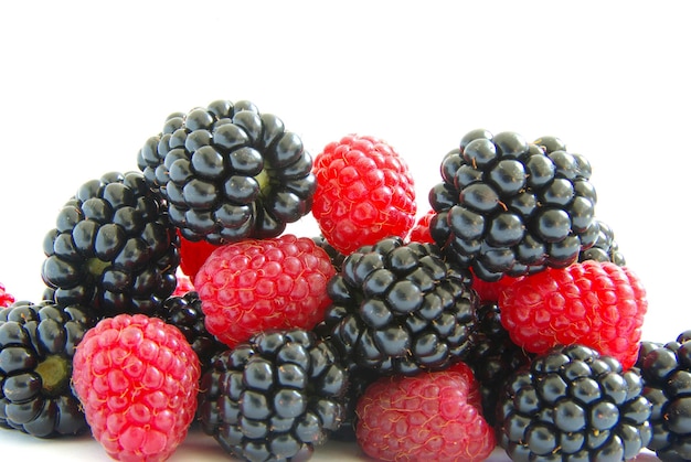 Raspberry and blackberry on white isolated background