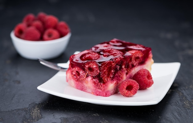 Raspberry Cake on a rustic slate slab closeup shot