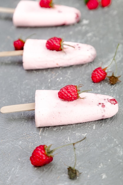 Raspberry ice cream on grey background