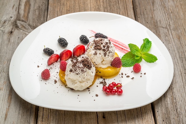 Raspberry ice cream in a wooden bowl