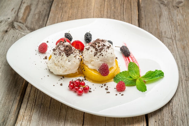 Raspberry ice cream in a wooden bowl