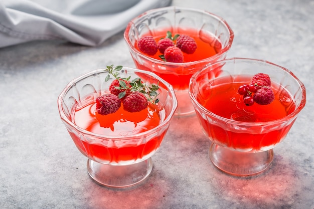 Raspberry jelly with fresh raspberries